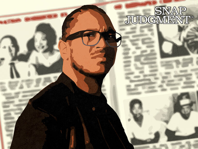 A man wearing glasses with newspaper clippings of Emmitt Till behind him.