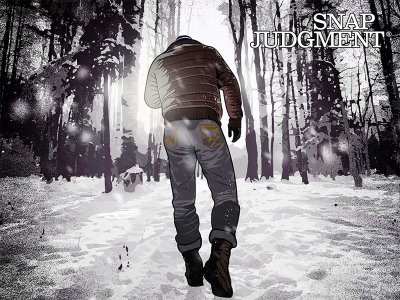 A man walking in the woods. The ground is covered in snow.