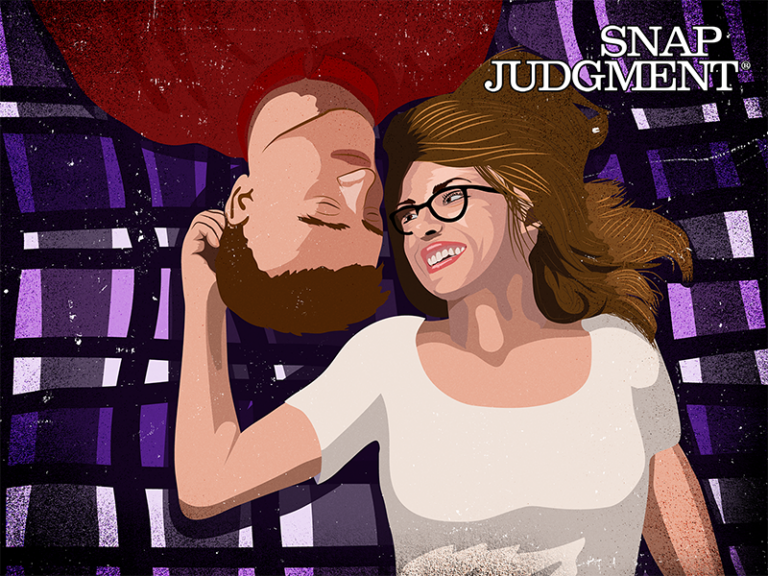 A man and woman are lying on a picnic blanket together, their faces are almost touching and they are smiling.