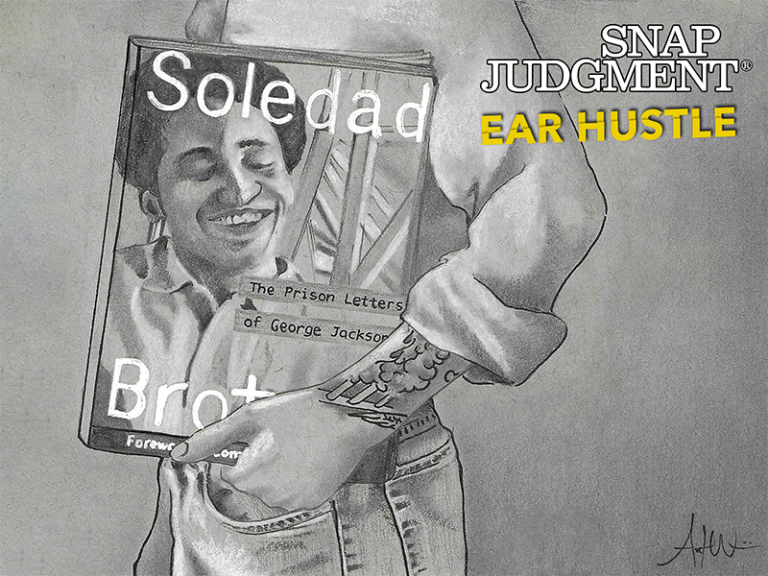 A man holding the "Soledad Brother" book against his side.