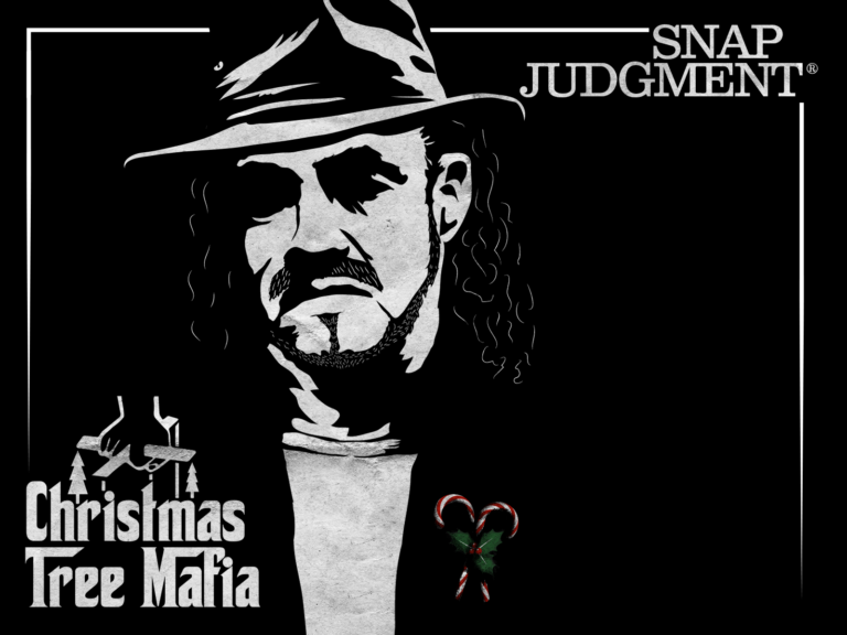 A man in a fedora is posed like the Godfather. He has candy canes in his lapel.