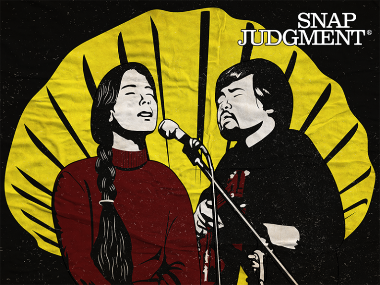 A man and woman are singing into a microphone. A yellow shell is in the background.