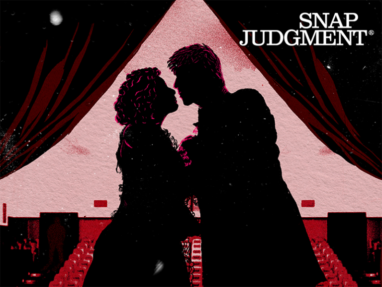 The silhouette of a man and woman on stage. They are performing Romeo and Juliet.