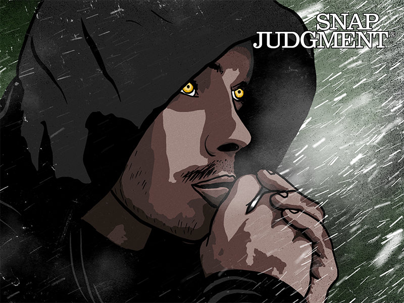 A man in a black hoodie and yellow eyes has his hands folded pressed against lips.