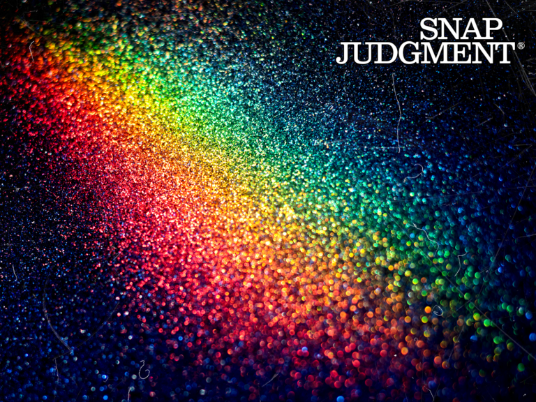 A rainbow on concrete is pictured.